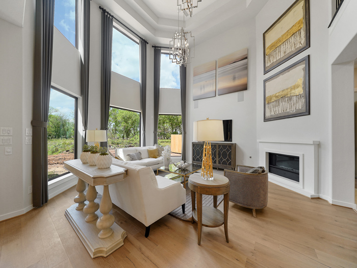 Stacked bay windows brighten Newmark Homes Model Home in Sienna