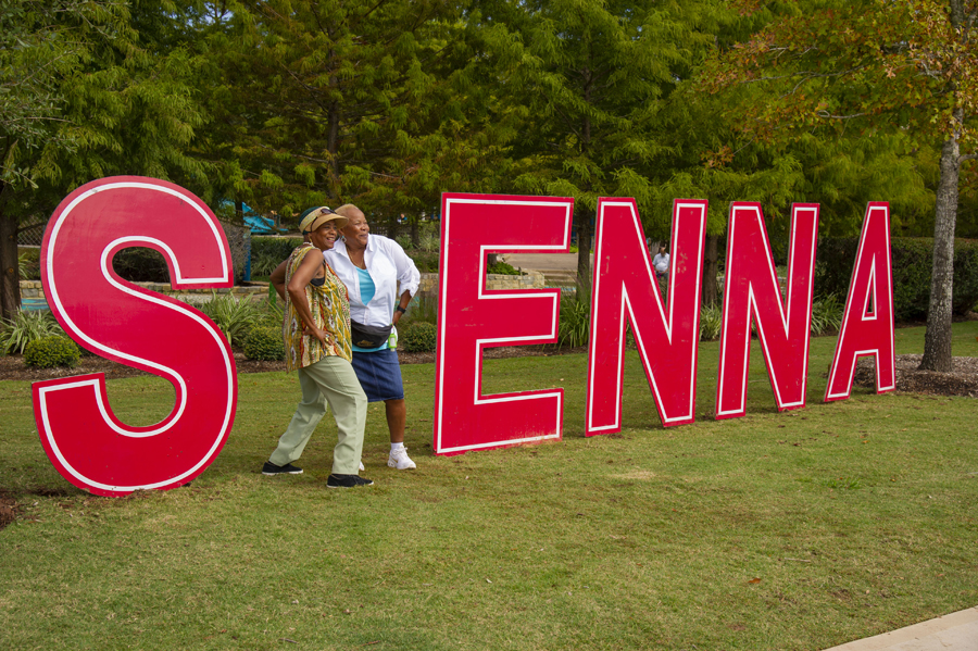 Taking a picture in front of the Sienna sign