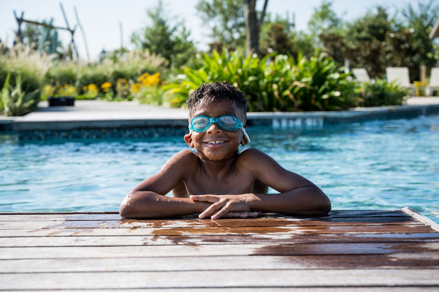 Sienna Kid Enjoying Pool Near Fort Bend New Construction Homes